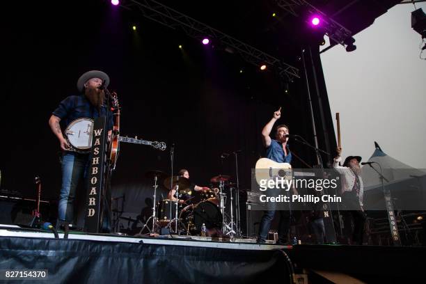 Chris Duncombe, Aaron Grain and David Roberts of The Washboard Union perform at the Rockin' River Country Music Festival on August 4, 2017 in...