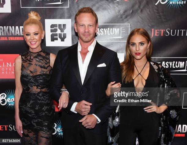 Actress Tara Reid, actor Ian Ziering and actress Cassie Scerbo attend the premiere of "Sharknado 5: Global Swarming" at The LINQ Hotel & Casino on...