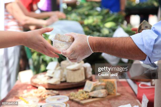 business transaction at farmer's market - agricultural fair stock pictures, royalty-free photos & images