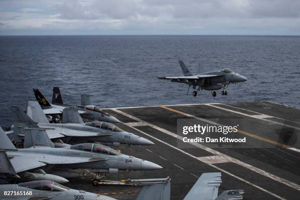 McDonnell Douglas F/A-18 Hornet lands during joint military exercise, Saxon Warrior, aboard the USS George H.W. Bush on August 6, 2017 off the north...