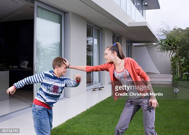 family life - brother fight stock pictures, royalty-free photos & images