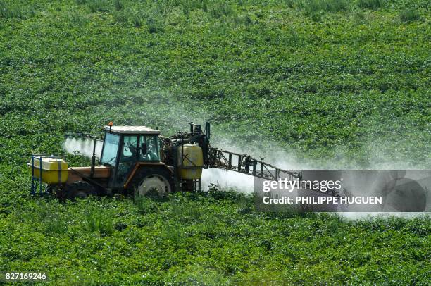 Farmer sprays phytosanitary products in a field in Meteren on August 7, 2017.