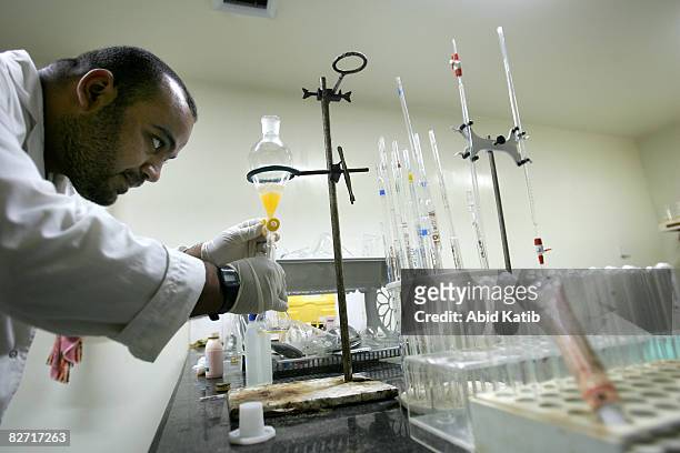 Scientist works at the laboratory at the Middle East Company for Pharmaceutical Industries September 08, 2008 in Bait Hanoun, Gaza Strip. Constructed...