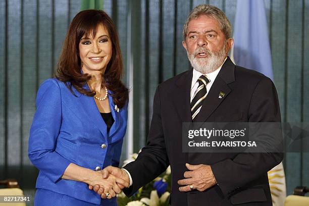 Argentina's President Cristina Fernandez de Kirchner and Brazil's President Luiz Inacio Lula da Silva shake hands during the welcoming ceremony at...