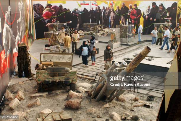 People visit a war museum assembled with captured machines and weapons from Israel during the 2006 war on August 27, 2008 in Nabatiyeh, southern...