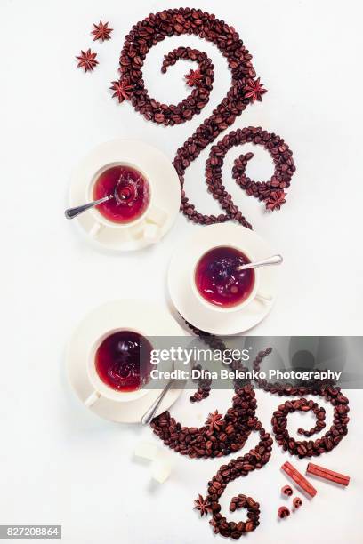 coffee grains lying in the shape of a swirl with the cup, cinnamon, anise stars - chocolate swirl from above stock pictures, royalty-free photos & images