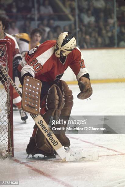 Canadian ice hockey player Bobby Taylor, goalkeeper for the Philadelphia Flyers, on the ice during a game against the Boston Bruins, early 1970s.