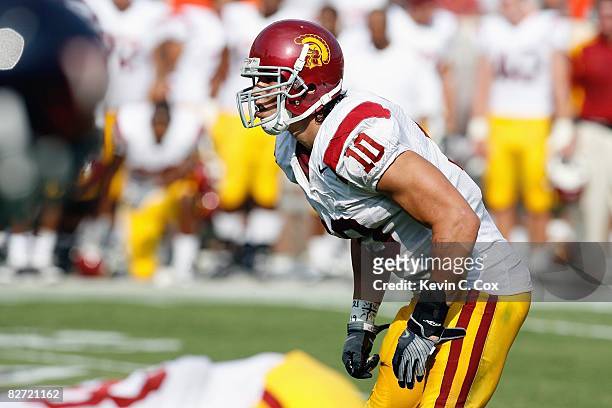 Brian Cushing of the Southern California Trojans gets ready on the field during the game against the Virginia Cavaliers at Scott Stadium on August...