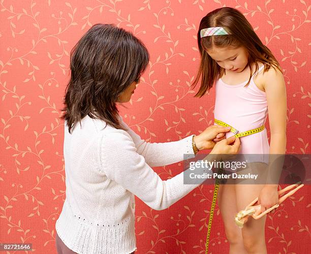 obsessive mum measuring daughter - vanity stock pictures, royalty-free photos & images