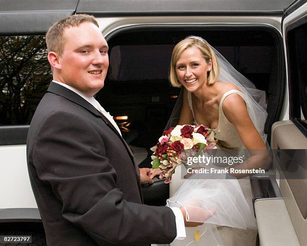 newly wedds getting into a limo - short wedding dress stock pictures, royalty-free photos & images