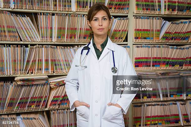 female doctor in medical clinic, portrait - doctor authority stock pictures, royalty-free photos & images