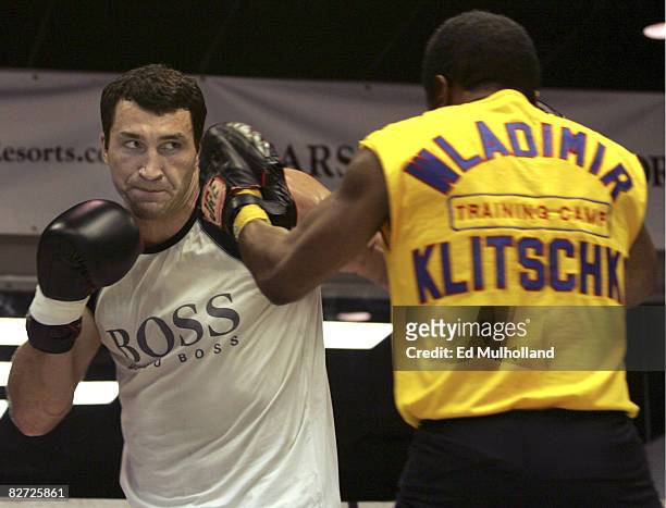 Heavyweight Wladimir Klitschko punches the mitts with trainer Emanuel Steward for his upcoming fight against Samuel Peter. Klitschko and Peter will...