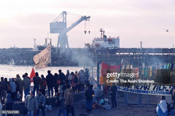 Anti- nuclear protesters hold a rally as plutonium carrying vessel 'Akatsuki' arrives at Tokai Port on January 5, 1993 in Tokai, Ibaraki, Japan.