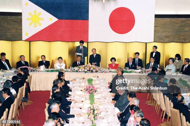 Japanese Prime Minister Kiichi Miyazawa addresses while Philippines President Fidel Ramos, his wife Amelita and Yoko Miyazawa listen during the...