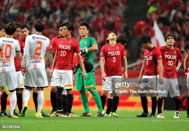 Urawa Red Diamonds players show dejection after the 2-2 draw in the J.League J1 match between Urawa Red Diamonds and Omiya Ardija at Saitama Stadium...