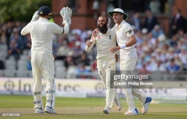 Moeen Ali of England celebrates with Stuart Broad after dismissing Theunis de Bruyn of South Africa during the fourth day of the 4th Investec Test...