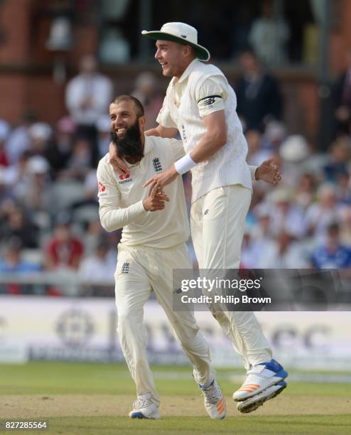 Moeen Ali of England celebrates with Stuart Broad after dismissing Theunis de Bruyn of South Africa during the fourth day of the 4th Investec Test...