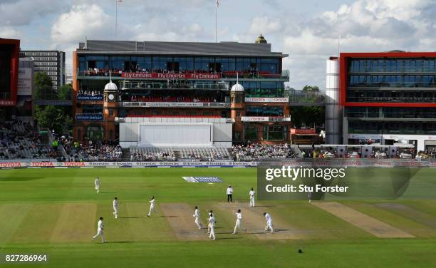 England bowler Moeen Ali takes the wicket of Quinton de Kock, caught by Alastair Cook at slip during day four of the 4th Investec Test match between...