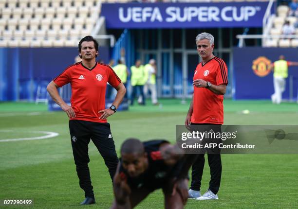 Manchester United's Portuguese manager Jose Mourinho and his assistant Rui Filipe da Cunha Faria look on during a training session ahead of the UEFA...