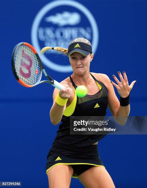 Kristina Mladenovic of France plays a shot against Barbora Strycova of Czech Republic during Day 3 of the Rogers Cup at Aviva Centre on August 7,...