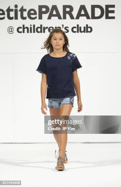 Young model walks the runway for ag kids collection during petitePARADE at Children's Club at Jacob Javitz Center on August 7, 2017 in New York City.