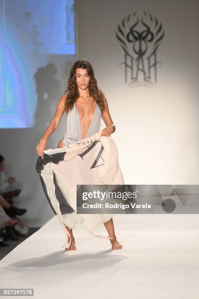 Model walks the runway at the SWIMMIAMI Hot-As-Hell 2018 Collection fashion show at 227 22nd Street on July 21, 2017 in Miami Beach, Florida.