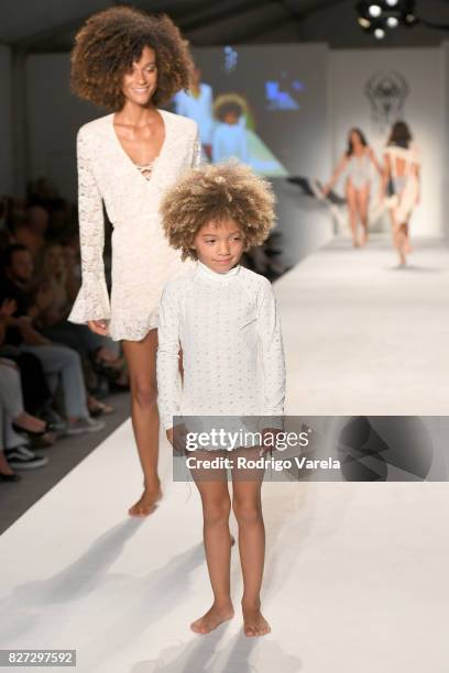 Model walks the runway at the SWIMMIAMI Hot-As-Hell 2018 Collection fashion show at 227 22nd Street on July 21, 2017 in Miami Beach, Florida.