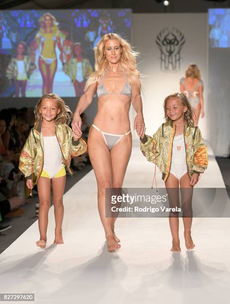 Model walks the runway at the SWIMMIAMI Hot-As-Hell 2018 Collection fashion show at 227 22nd Street on July 21, 2017 in Miami Beach, Florida.