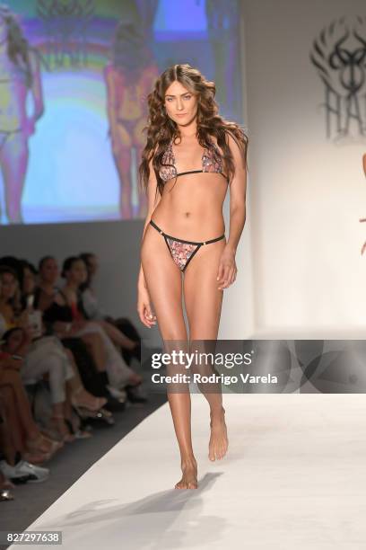 Model walks the runway at the SWIMMIAMI Hot-As-Hell 2018 Collection fashion show at 227 22nd Street on July 21, 2017 in Miami Beach, Florida.