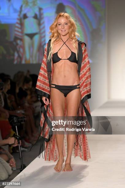 Model walks the runway at the SWIMMIAMI Hot-As-Hell 2018 Collection fashion show at 227 22nd Street on July 21, 2017 in Miami Beach, Florida.