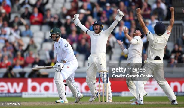 Jonathan Bairstow, Ben Stokes and Alastair Cook of England celebrates the final wicket of Duanne Olivier of South Africa to win the 4th Investec Test...