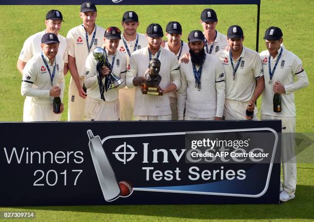 England's captain Joe Root stands with teammates as they celebrate winning the fourth Test match, and Test series, against South Africa, on day 4 of...