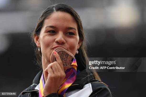 Bronze medalist Venezuela's Robeilys Peinado poses on the podium during the victory ceremony for the women's pole vault athletics event at the 2017...