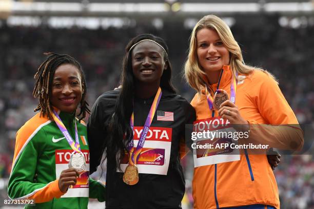 Silver medallist Ivory Coast's Marie-Josée Ta Lou , gold medallist US athlete Tori Bowie and bronze medallist Netherlands' Dafne Schippers pose on...