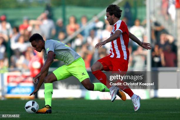 Shqipon Bektashi of Steinbach challenges Nikolas Nartey of Kln during the preseason friendly match between TSV Steinbach and 1. FC Koeln at...