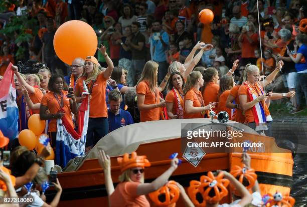 The Dutch player's football women team celebrate the victory on a boat in Utrecht on August 7, 2017 after Dutch women players's won the UEFA Women's...