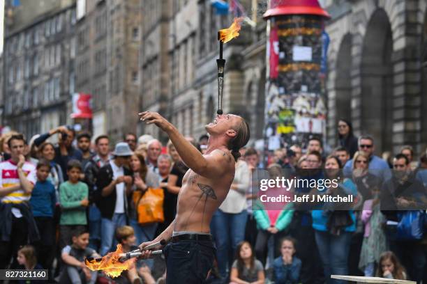 Edinburgh Festival Fringe entertainers perform on the Royal Mile on August 7, 2017 in Edinburgh, Scotland. This year marks the 70th anniversary of...