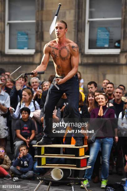 Edinburgh Festival Fringe entertainers perform on the Royal Mile on August 7, 2017 in Edinburgh, Scotland. This year marks the 70th anniversary of...