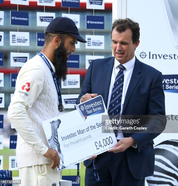 Moeen Ali of England receives his man of series award from Tom Harrison, Chief Executive of the ECB after winning the Investec Test series between...
