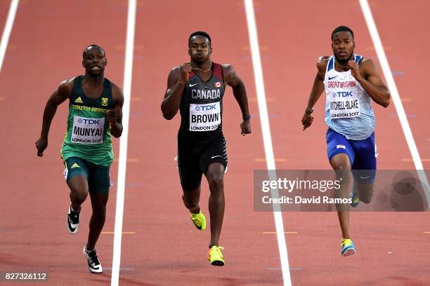 Clarence Munyai of South Africa, Aaron Brown of Canada and Nethaneel Mitchell-Blake of Great Britain competes in the Men's 200 metres heats during...