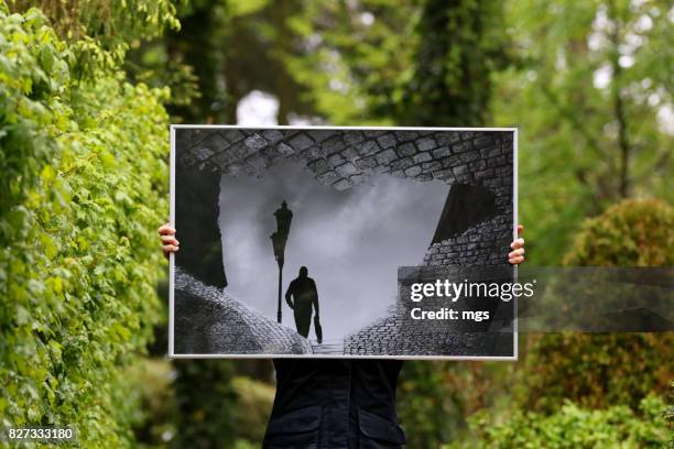 printing your own photos is fun. - hand printing of trees foto e immagini stock