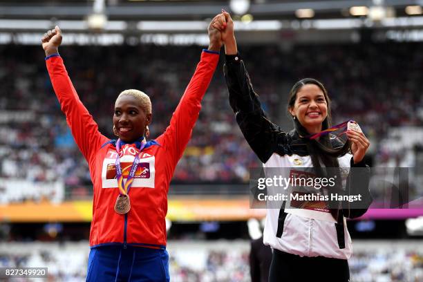 Yarisley Silva of Cuba, bronze, and Robeilys Peinado of Venezuela, bronze, pose with their medals for the Women's Pole Vault during day four of the...