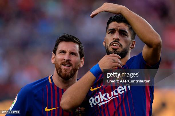 Barcelona's Argentinian forward Lionel Messi and Barcelona's Uruguayan forward Luis Suarez look on during the 52nd Joan Gamper Trophy friendly...