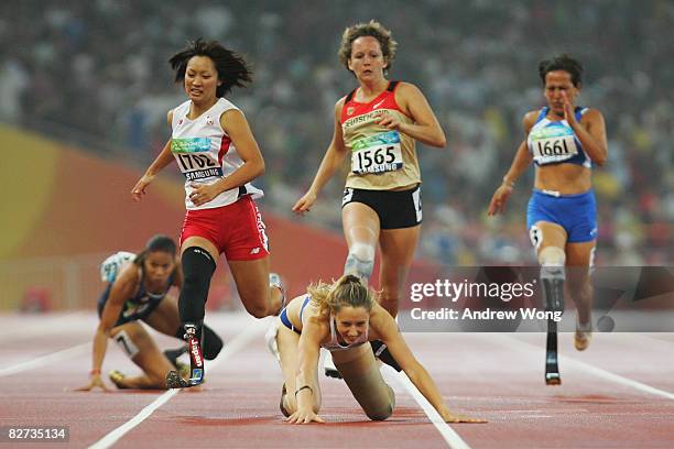 April Holmes of the United States and Marie-Amelie le Fur of France fall during the final of the Women's 200M - T44 Athletics event at the National...