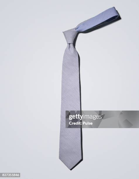 blue tie on light background. - tie the knot nyc stock pictures, royalty-free photos & images