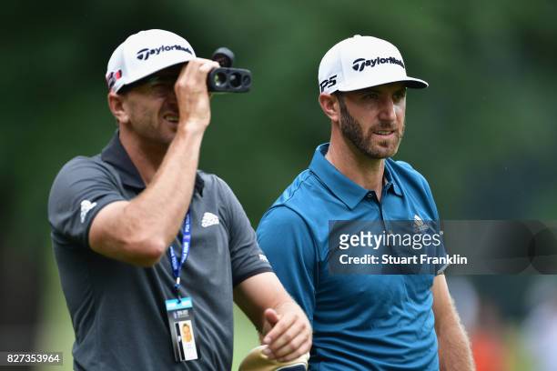 Dustin Johnson looks on during a practice round prior to the 2017 PGA Championship at Quail Hollow Club on August 7, 2017 in Charlotte, North...