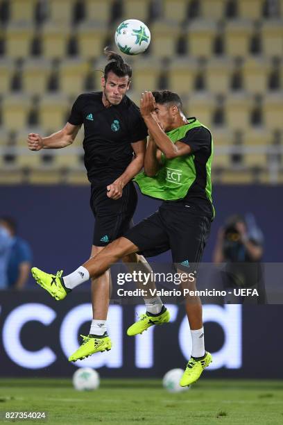 Gareth Bale of Real Madrid is challenged during the training session ahead of the UEFA Super Cup between Real Madrid and Manchester United at...