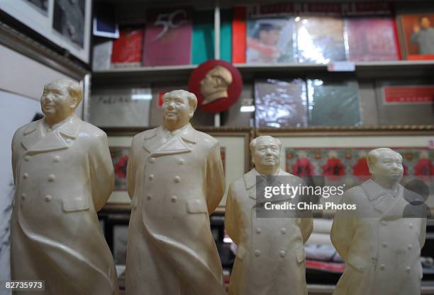 Statues of the late Chinese leader Mao Zedong, along with posters used during the Cultural Revolution period, are displayed in a Mao-era collection...