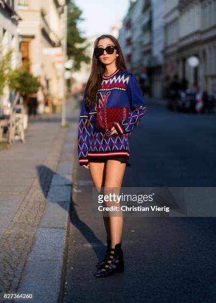 Nadja Ali wearing a navy blue MSGM knit, black Levis shorts, Lala Berlin boots, Celine sunglasses, Chanel necklace on August 7, 2017 in Berlin,...