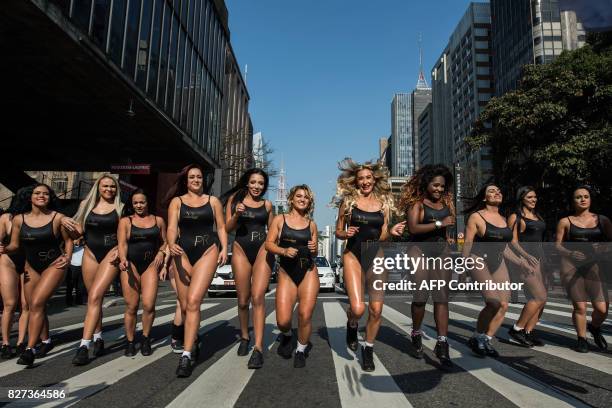 Models take part in the promotion of the Miss Bumbum beauty pageant, along Paulista Avenue in Sao Paulo, Brazil, on August 7, 2017. The annual Bumbum...
